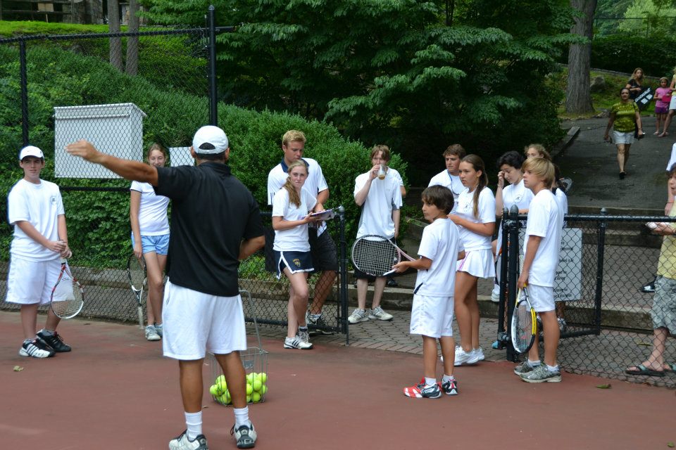 junior tennis players at practice
